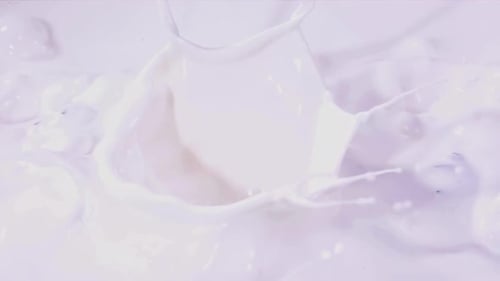 Berries Splashing into Creamy White Liquid Close-up Shot