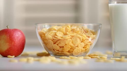Golden Corn Flakes, Milk and a Red Apple