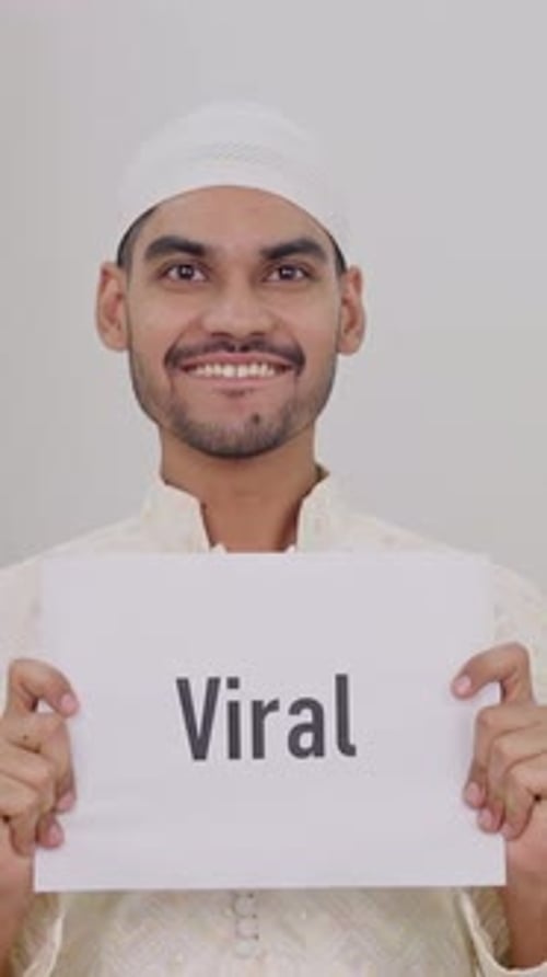Young Adult Holding Viral Sign in Studio