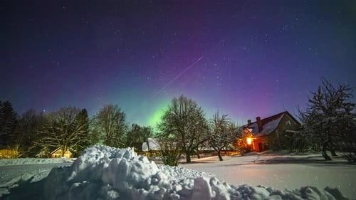 the green dancing light of the northern lights in a fairytale Christmas atmosphere. Time lapse