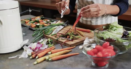 Subject Peels a Carrot in a Kitchen