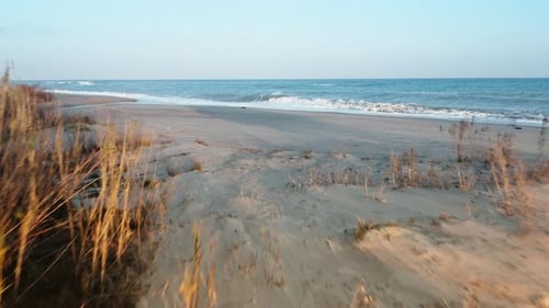 Aerial View of Coastline with Crashing Waves