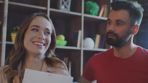 Laughing Businesswoman Talking with Coworkers in Office. Professional Team Discussing Idea On