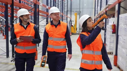 Warehouse Workers Checking Inventory with Barcode Scanners