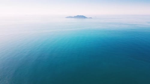 Aerial View of the Remote Island in the Calm Ocean