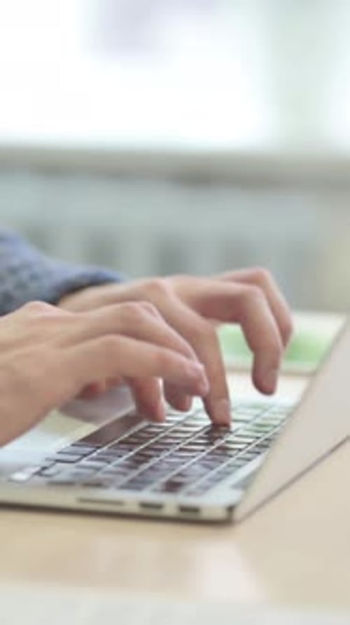 Close up of Hands Typing on Laptop, vertical video