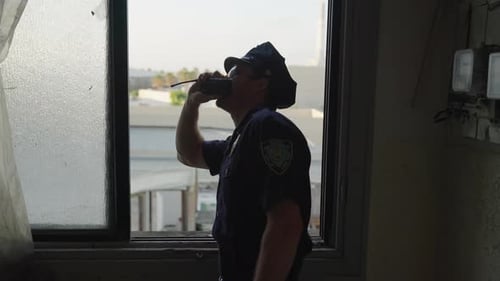 Police Officer Communicates Via Radio