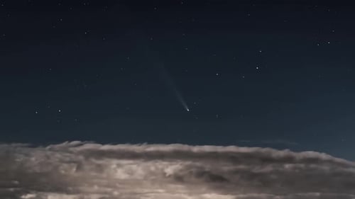 Night Sky with Comet and Clouds Time Lapse