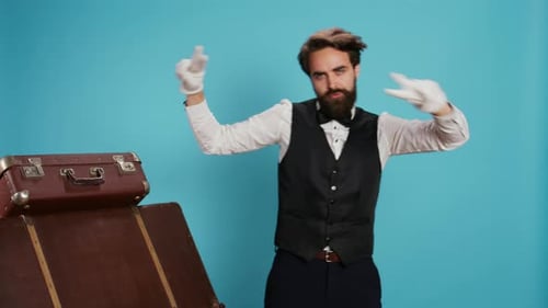 Bearded Man Grooving in Studio with Vintage Suitcases