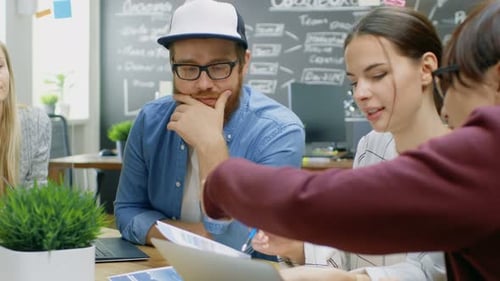 Team Collaborating on a Project in an Office