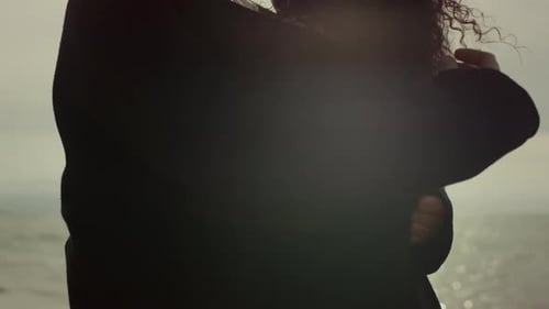 Two People Hugging Together At Sea Beach. Multiethnic Young Couple Hands Touch Curly Hair Close U...