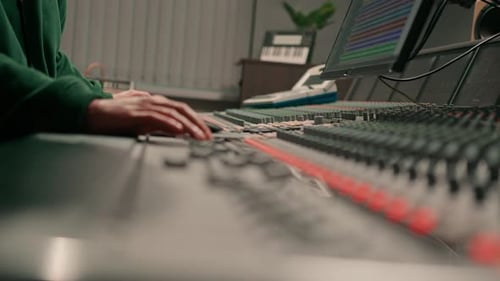 Sound engineer used digital audio mixer Sliders Engineer presses keys Control panel Recording studio