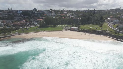 Ocean Waves At Bronte Beach During Sunny Summer Day - Bronte Beach Park, NSW, Australia. - aerial pu