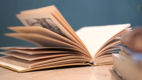 Open Antique Book on Wooden Table