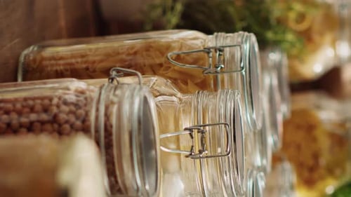 Glass Jars Filled with Food Ingredients in Pantry