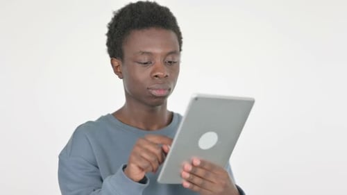 Young Adult Using Tablet Device Indoors