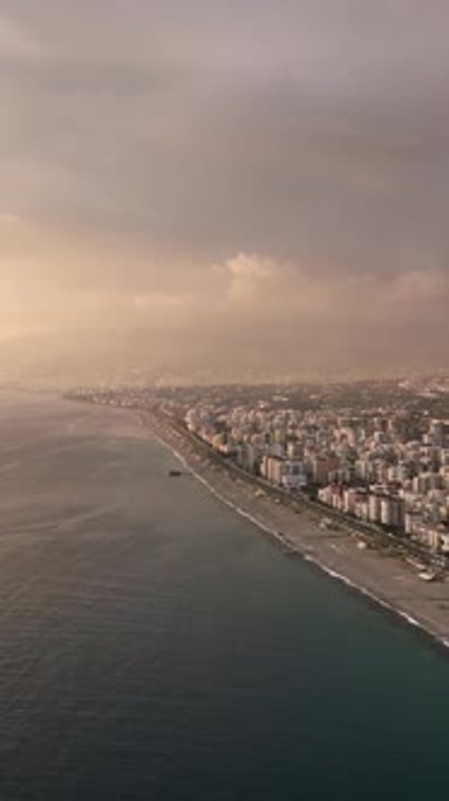 Vertical Video Coastal Radiance Aerial Perspective of a Beautiful Sea Sunset