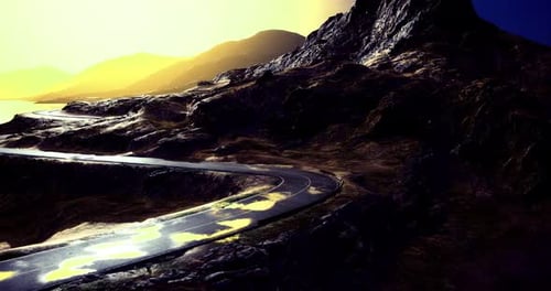 Winding Mountain Road Under a Dramatic Sunset Sky with Vibrant Colors