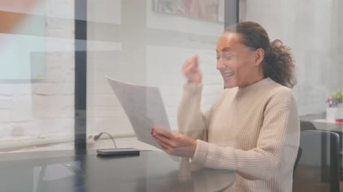 Happy Woman Receives Good News at Work