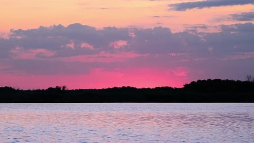 Early morning on calm river with fog. Sunrise over lake and beautiful morning landscape