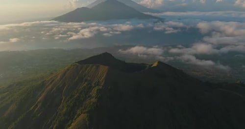 Spectacular morning view of volcano Mount Batur with large crater, aerial