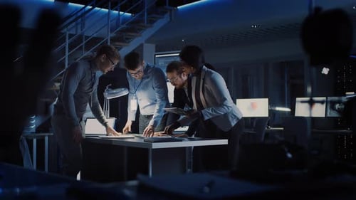 Team of Colleagues Collaborating on Project in Office