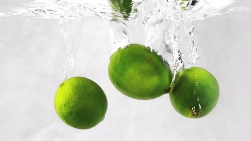 Green Limes Submerge and Float in Water