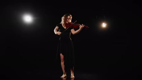 Lonely Woman Playing Violin on Theatre Stage in Darkness Talented Musician Inspired Lady Performing