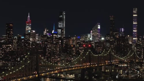 Illuminated New York City Skyline Enchants at Night Showcasing Iconic Manhattan Skyscrapers and