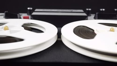 Rotating Reels of Vintage Audio Recorder Machine