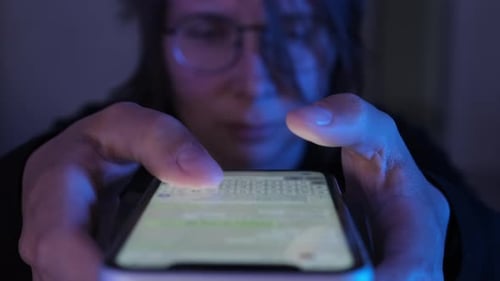 Close up, young woman use of mobile phone, fast shooting, female hands typing and messaging