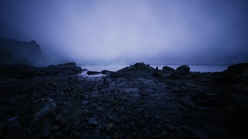 Serene Figures Sit Still Peaceful Shadows Linger on Rugged Coastlines
