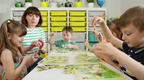 Children Play Wooden Puzzle Game in Classroom