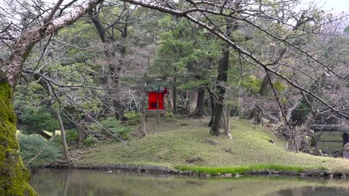 Red Buddhist Shrine At The Koishikawa Korakuen Gardens In Winter -