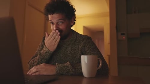 Man Video Chatting Smiling at Home at Night