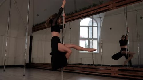 Pole Dancer Does Acrobatic Elements Athletic Young Woman Performs Tricks on Pylon Modern Sport and