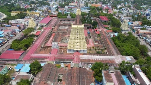 Aerial drone shot the architectural beauty of Rameshwaram temple and the bustling city around it.