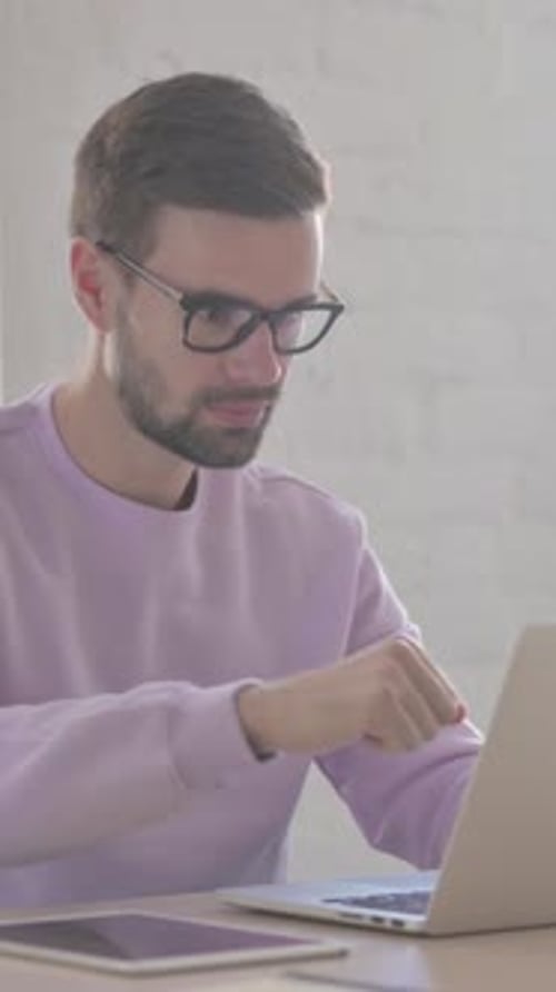 Online Video Call by Young Man in Office, Vertical Video