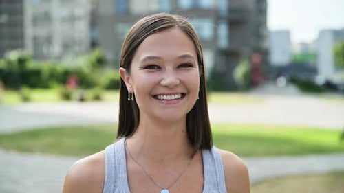 Young Woman Smiling Beautifully Outdoors in the City
