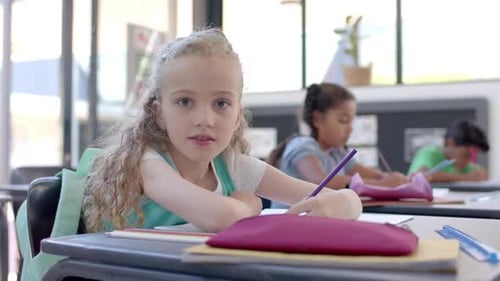 Caucasian girl studying in a school classroom