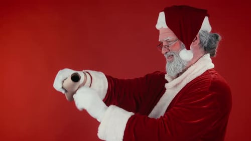 Santa Claus Reading the Nice List on Red