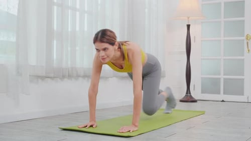Fit Woman Doing Mountain Climber Exercise Indoors