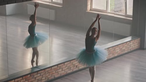 Young Woman Dancing Ballet in a Studio
