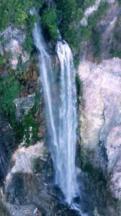 Aerial View Waterfall of Mountain Falling in Green Nature of Forest Landscape