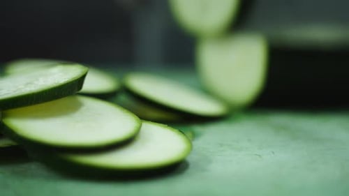 Slicing Fresh Zucchini on a Cutting Board