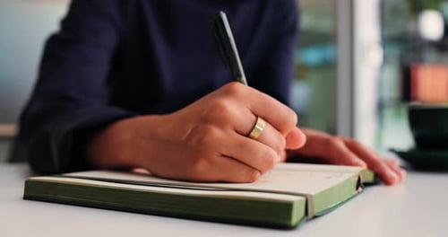 Creative, writing and hands with journal, office or draft for story, reporter