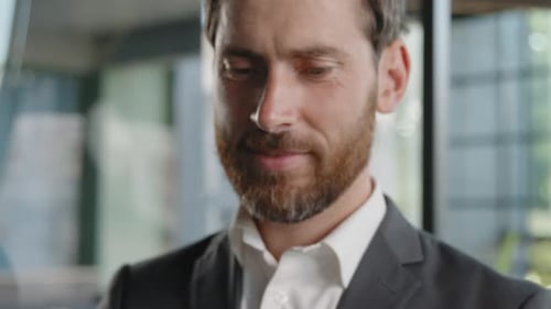 Smiling Man Using Cell Phone Close Up