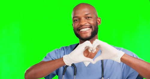 Heart, green screen doctor and happy black man face with love gesture for healthcare