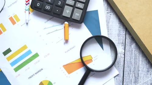 Financial Graph Calculator and Notepad on Table