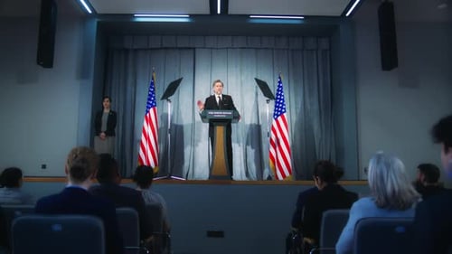 Man Speaking at Podium at Political Event